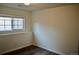 Bright bedroom featuring a window, neutral paint, and attractive laminate floors at 9713 W Chatfield Ave # H, Littleton, CO 80128