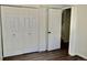 Bedroom with multiple door closet with black hardware at 9713 W Chatfield Ave # H, Littleton, CO 80128
