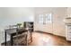 Cozy dining area with a dining table, chairs, and access to the backyard through double doors at 9713 W Chatfield Ave # H, Littleton, CO 80128