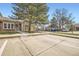 Charming single-story home featuring a brick exterior and mature landscaping at 9713 W Chatfield Ave # H, Littleton, CO 80128