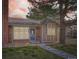 Charming home with a brick facade, well-manicured lawn, and inviting front entrance at 9713 W Chatfield Ave # H, Littleton, CO 80128