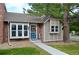Inviting home with a brick and siding facade, well-maintained lawn, and a pleasant entryway at 9713 W Chatfield Ave # H, Littleton, CO 80128