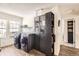 Laundry room featuring front load washer and dryer, cabinets, and natural light at 9713 W Chatfield Ave # H, Littleton, CO 80128
