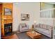 Cozy living room with fireplace, comfortable seating, and stylish decor creating a relaxing atmosphere at 9713 W Chatfield Ave # H, Littleton, CO 80128