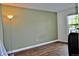 Home office with a floor lamp, and a window bringing in natural light at 9713 W Chatfield Ave # H, Littleton, CO 80128