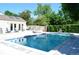 Backyard pool with a lounge area perfect for relaxation and outdoor entertaining at 9713 W Chatfield Ave # H, Littleton, CO 80128