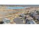 Beautiful aerial view of homes near a lake and walking trails at 2520 E 127Th Ave, Thornton, CO 80241