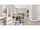 Open-concept dining area connecting to the living room, featuring modern decor and natural light at 2520 E 127Th Ave, Thornton, CO 80241