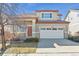 Charming two-story home with a welcoming front porch and attached two-car garage at 2520 E 127Th Ave, Thornton, CO 80241