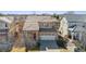 Aerial view of a suburban two-story house featuring a two-car garage and a cozy, well-kept front yard at 2520 E 127Th Ave, Thornton, CO 80241