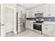 Modern kitchen featuring stainless steel appliances, light cabinets, and a subway tile backsplash at 2520 E 127Th Ave, Thornton, CO 80241