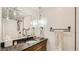 Modern bathroom features a stylish vanity with granite countertops and unique pendant lighting fixtures at 2231 Meadow Green Cir, Franktown, CO 80116