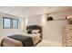 Cozy bedroom showcases a comfortable bed with a tufted headboard and a neutral color palette at 2231 Meadow Green Cir, Franktown, CO 80116