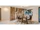 Dining room boasts wood accent wall with a modern table and chair set at 2231 Meadow Green Cir, Franktown, CO 80116
