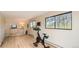 Spacious exercise room with hardwood floors, large windows, and fitness equipment at 2231 Meadow Green Cir, Franktown, CO 80116
