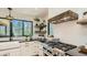 Kitchen with stainless steel range, black countertops, white cabinetry and corner shelving at 2231 Meadow Green Cir, Franktown, CO 80116