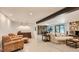 Spacious living room features neutral colors, wood accents, and comfortable seating at 2231 Meadow Green Cir, Franktown, CO 80116