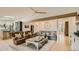 Spacious living room with hardwood floors, ceiling fan and comfortable seating at 2231 Meadow Green Cir, Franktown, CO 80116