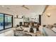 Bright living room with a fireplace, large windows, and skylights at 2231 Meadow Green Cir, Franktown, CO 80116