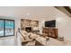Comfortable living room features a stone fireplace and view to the backyard at 2231 Meadow Green Cir, Franktown, CO 80116