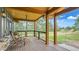 Inviting outdoor porch with comfortable seating and scenic views of the lush landscape at 2231 Meadow Green Cir, Franktown, CO 80116
