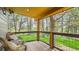 Relaxing porch area featuring comfortable seating and panoramic views of the surrounding greenery at 2231 Meadow Green Cir, Franktown, CO 80116