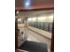 Well-lit hallway with mailboxes, neutral walls, and a glimpse into a clean, organized space at 8060 E Girard Ave # 504, Denver, CO 80231