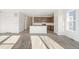 Open kitchen with stainless appliances, island, and quartz countertops at 13412 E 110Th Way, Commerce City, CO 80022