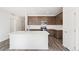 Open kitchen features island, stainless appliances, and quartz countertops at 13412 E 110Th Way, Commerce City, CO 80022