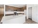 Kitchen features stainless appliances, white backsplash, and quartz countertops at 13412 E 110Th Way, Commerce City, CO 80022
