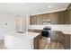 Kitchen features stainless appliances, white backsplash, and quartz countertops at 13412 E 110Th Way, Commerce City, CO 80022