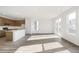 Open-concept living space featuring light wood floors, and lots of natural light at 13412 E 110Th Way, Commerce City, CO 80022