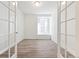 Bright office with wood floors, white walls, French doors and large window at 13412 E 110Th Way, Commerce City, CO 80022