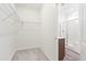 Walk-in closet featuring carpet floors, wire shelving and easy access to the bathroom at 13412 E 110Th Way, Commerce City, CO 80022