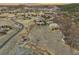 Expansive aerial view of the community and surrounding landscape with rolling hills under a colorful sunset sky at 4749 Starfire Cir, Castle Rock, CO 80104