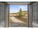 View from balcony overlooking a picturesque scene with mature trees and beautiful landscape with a clear blue sky at 4749 Starfire Cir, Castle Rock, CO 80104