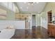 Spacious bathroom featuring a soaking tub and large glass-enclosed shower with dual shower heads and elegant tiling at 4749 Starfire Cir, Castle Rock, CO 80104