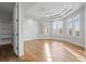 Light-filled bedroom featuring hardwood floors, large windows, and tray ceiling at 4749 Starfire Cir, Castle Rock, CO 80104