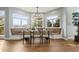 Eat-in dining space with large windows, a chandelier, and built-in seating for comfortable Gathering meals at 4749 Starfire Cir, Castle Rock, CO 80104