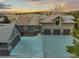 An aerial view of the house, a three car garage, and a separate one-car garage at 4749 Starfire Cir, Castle Rock, CO 80104