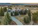 Beautiful front exterior view of home with circular driveway and professional landscaping at 4749 Starfire Cir, Castle Rock, CO 80104