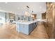 Gourmet kitchen with a large island, custom cabinetry, and an open floor plan at 4749 Starfire Cir, Castle Rock, CO 80104