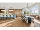 Eat-in kitchen featuring an island, stainless appliances, and custom dining nook with lots of light at 4749 Starfire Cir, Castle Rock, CO 80104