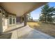 Covered patio boasting stone columns, serene views, and an ideal space for relaxing or entertaining guests at 4749 Starfire Cir, Castle Rock, CO 80104