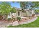 Charming backyard with a small bridge, rock landscaping and lush greenery at 9705 Autumnwood Pl, Highlands Ranch, CO 80129