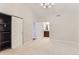 Bedroom with neutral carpet, closet, and bathroom view at 9705 Autumnwood Pl, Highlands Ranch, CO 80129
