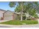Charming single-Gathering home featuring a lush front yard with mature trees and an attached two-car garage at 9705 Autumnwood Pl, Highlands Ranch, CO 80129