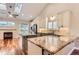 Spacious kitchen featuring modern design, granite countertops, and ample cabinet space at 9705 Autumnwood Pl, Highlands Ranch, CO 80129