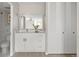 Bright bathroom featuring a white vanity, modern fixtures, and a clean, organized layout with white closet doors at 4570 E Yale Ave # 507, Denver, CO 80222