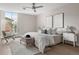 Spacious bedroom with a ceiling fan, comfortable bedding, and a serene atmosphere at 4570 E Yale Ave # 507, Denver, CO 80222